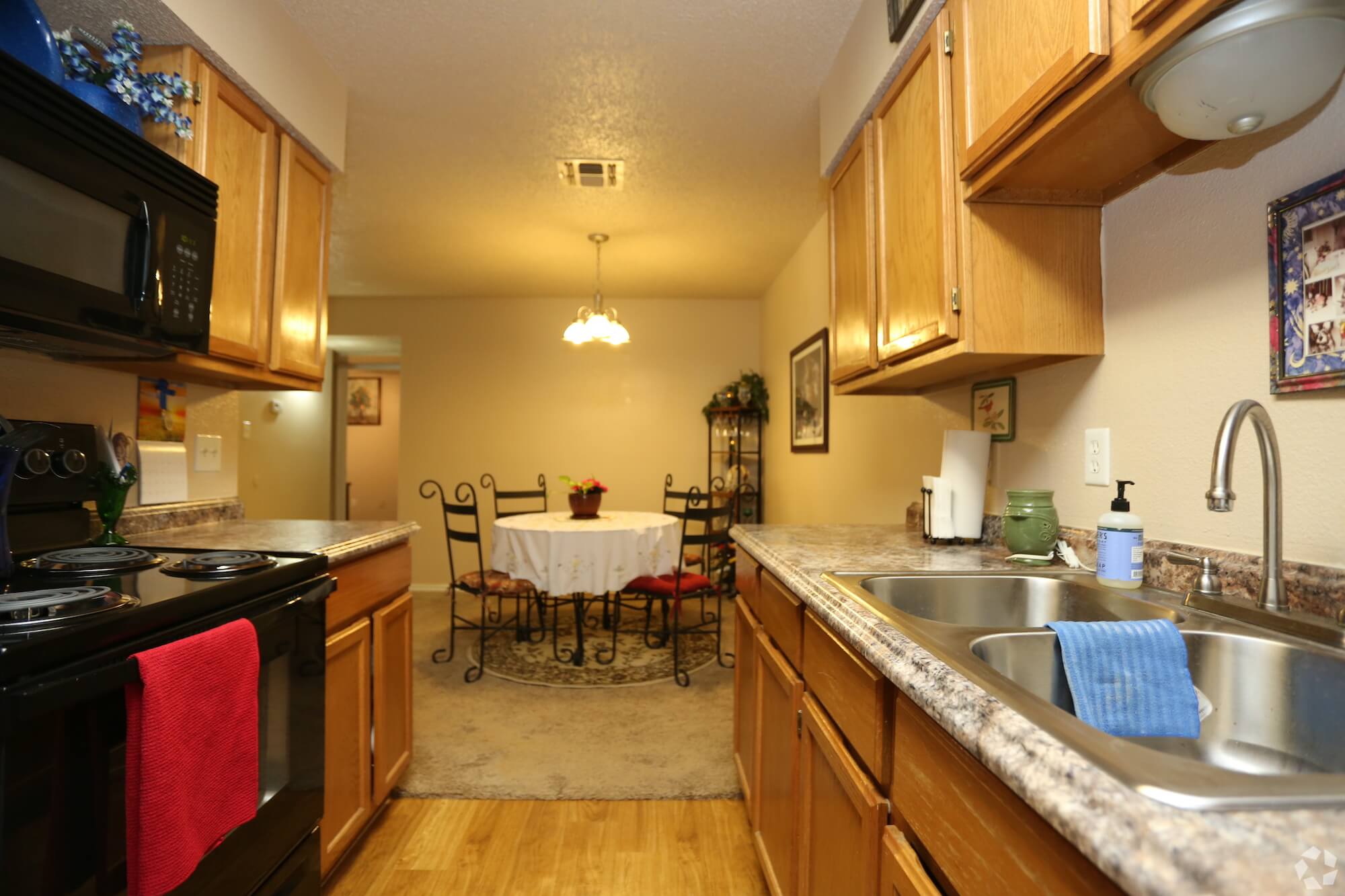 Arbors of Boerne Apartments kitchen and dining area in unit.