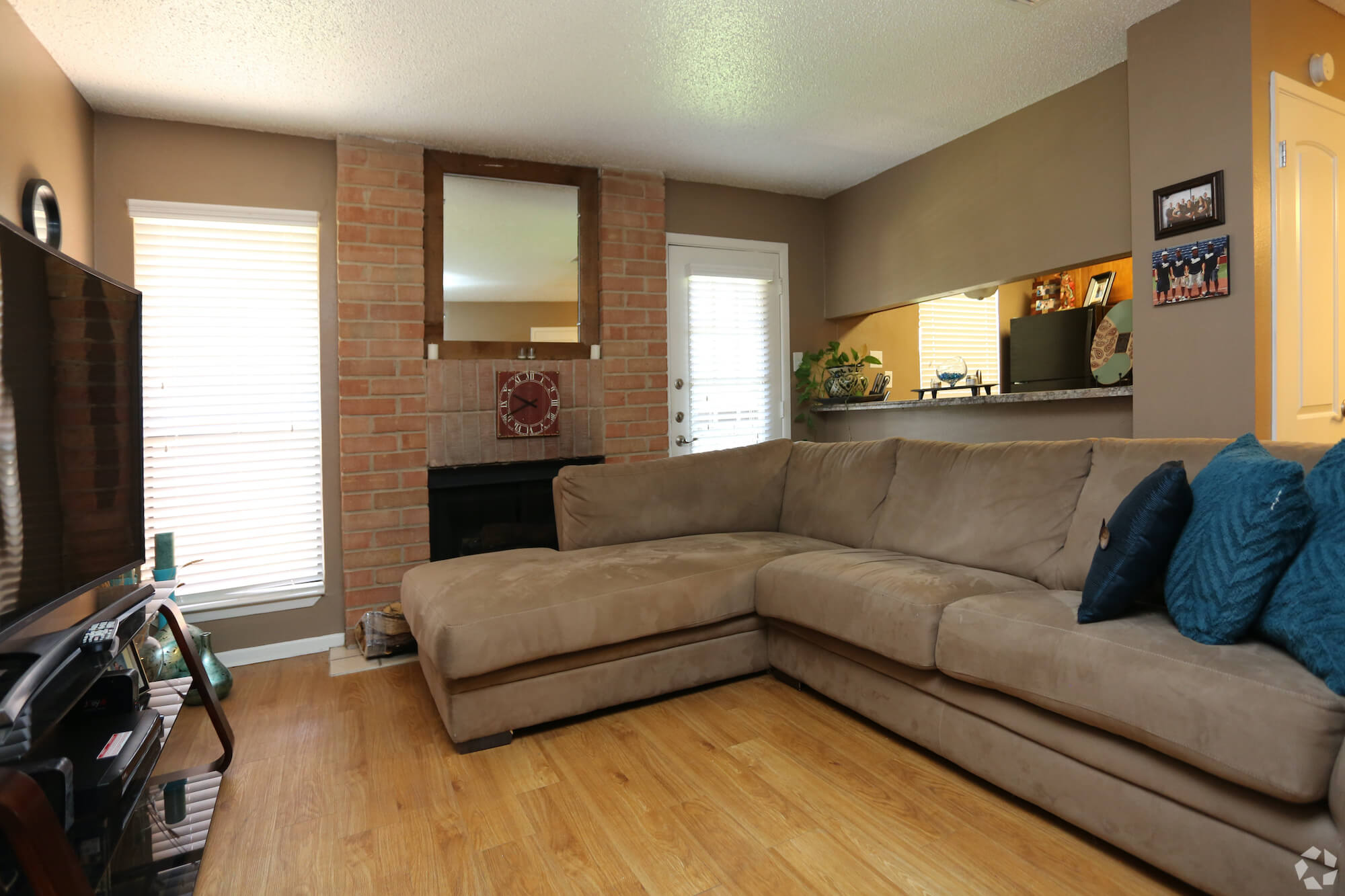 Arbors of Boerne Apartments living room with kitchen window.