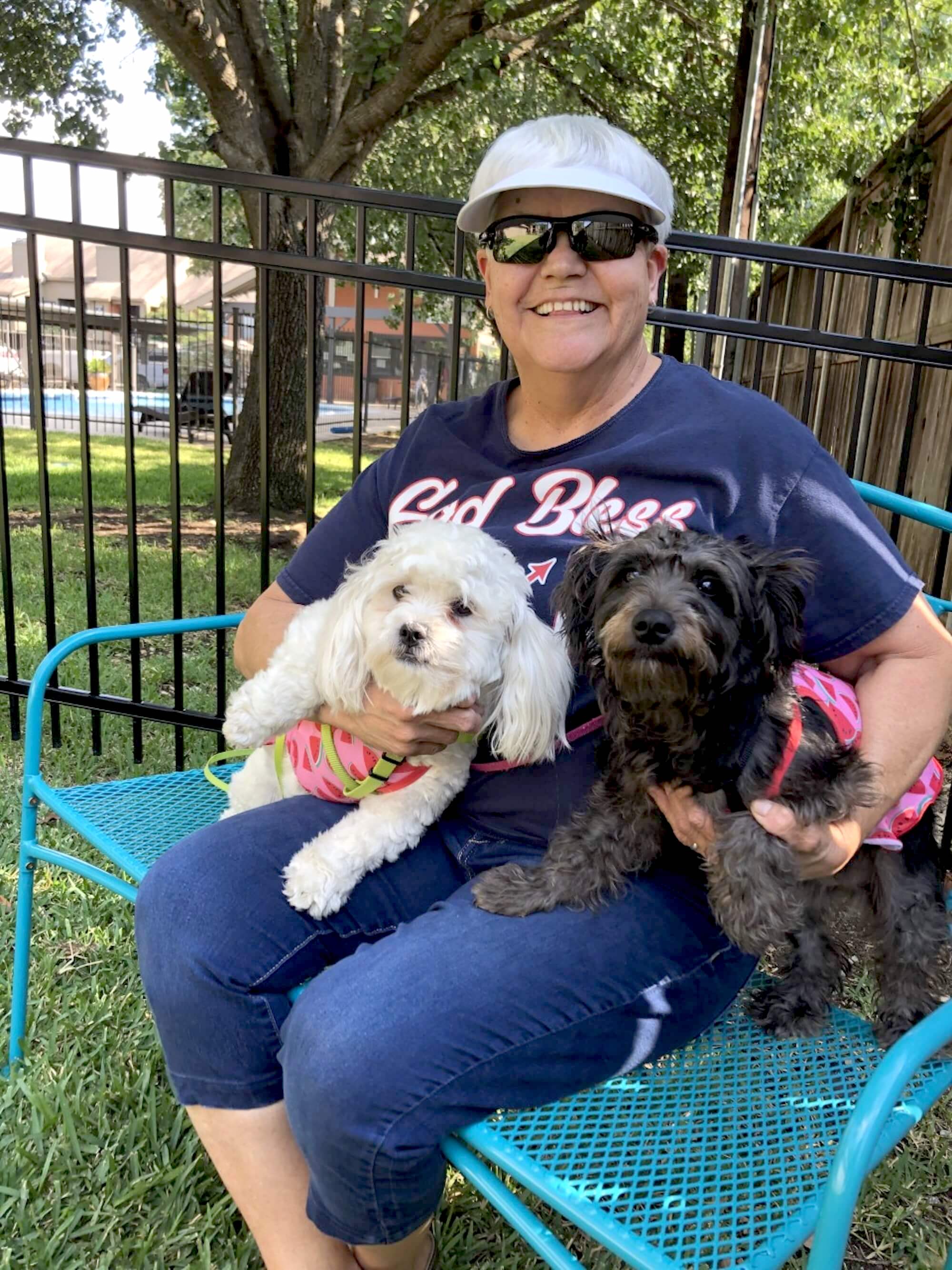 Arbors at Boerne Apartments female resident and her 2 small black and white dogs. 